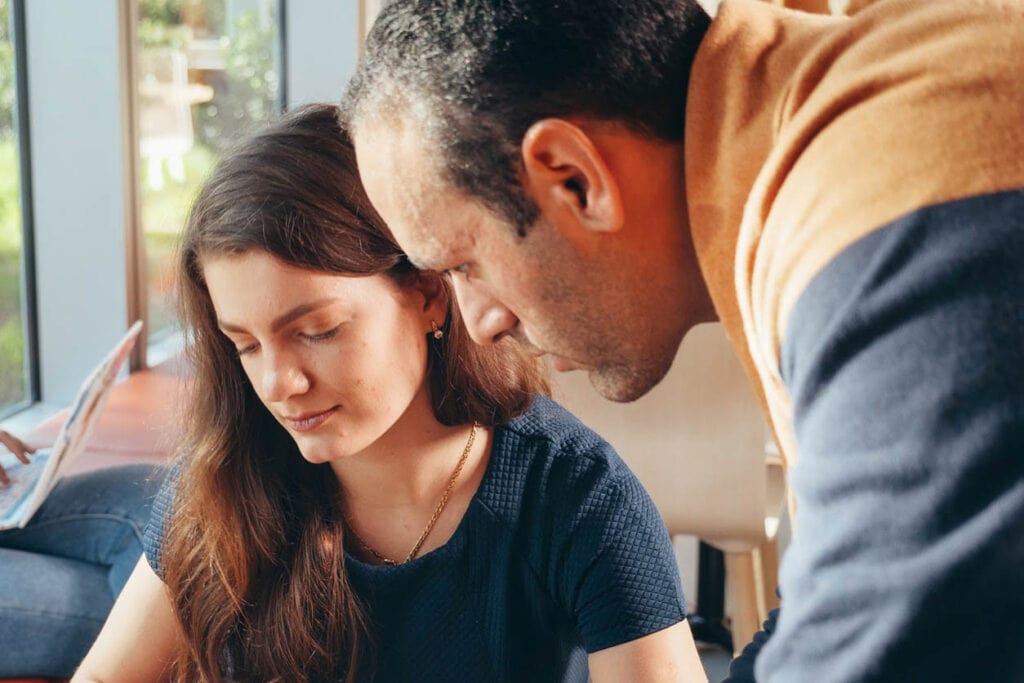 couple discussing their financial health and how they can improve it