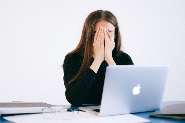 Woman feeling overwhelm about debt