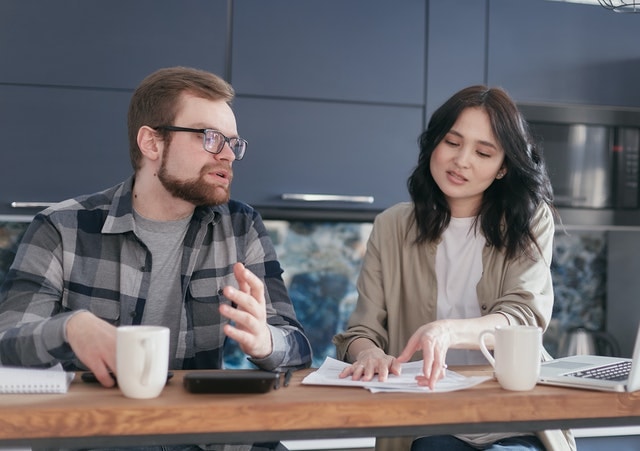 man and woman discussing their 2020 tax return