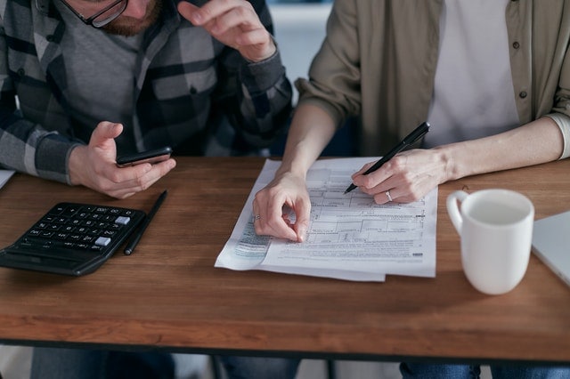 two people making a debt relief plan to get out of debt