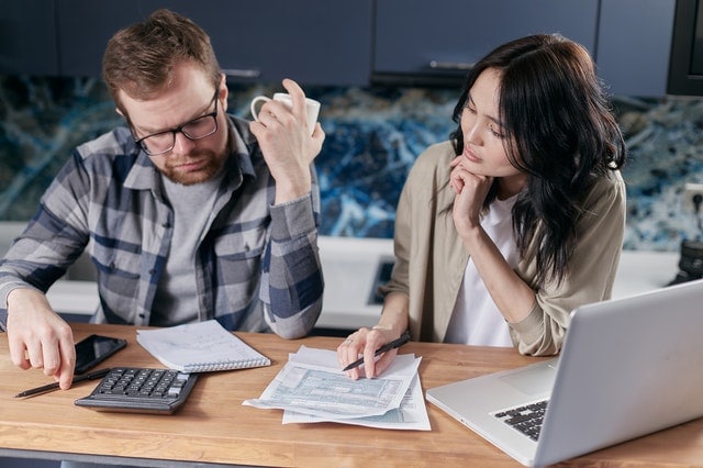 young couple considering a debt relief company