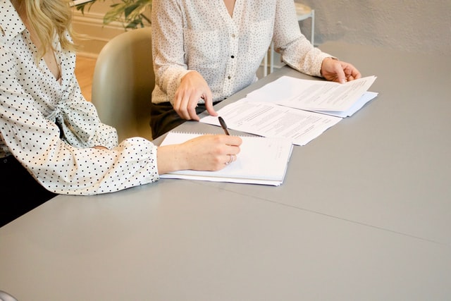 two people reviewing their joint bank account statement